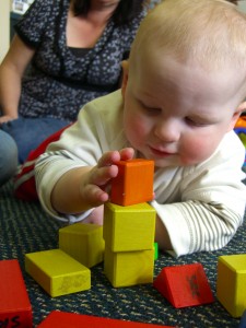 Ryan building a tower with blocks