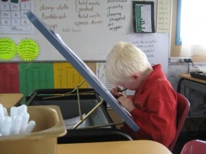 Writing at the tilting-top desk